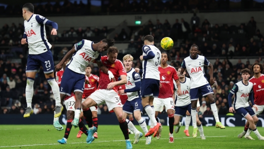 Jonny Evans of Manchester United scores his team's third goal during the Carabao Cup Quarter Final match between Tottenham Hotspur and Manchester United at Tottenham Hotspur Stadium on December 19, 2024 in London, England. (Photo by Alex Pantling/Getty Images)