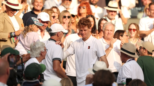 Jannik Sinner with his coach Darren Cahill after winning Wimbledon