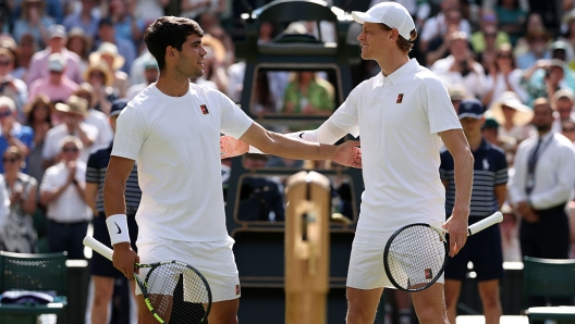 Carlos Alcaraz and Jannik Sinner at the net
