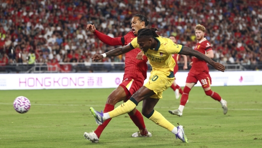 Rafael Leao of AC Milan celebrates scoring the opening goal against Liverpool FC.