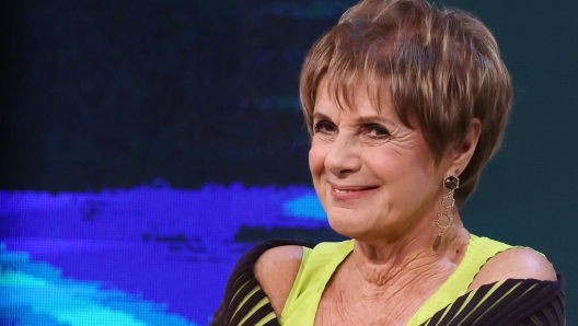 Lella Costa at a public event, engaging with an audience
