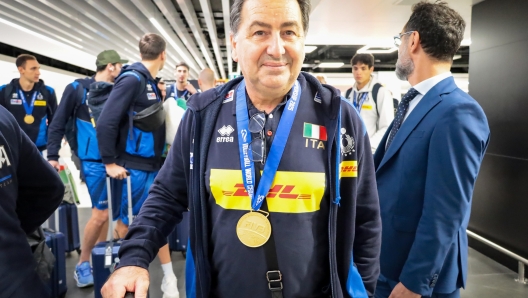 Italian National Volleyball Coach Ferdinando De Giorgi holding the World Championship trophy
