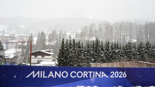 A Milano Cortina 2026 poster is displayed ahead of the 2026 Winter Olympics, in Cortina d'Ampezzo, Italy, Wednesday, Feb. 4, 2026. (AP Photo/Fatima Shbair)