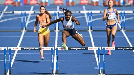 Italy's Ayomide Folorunso (C) competes in the women's 400m hurdles semi-final during the European Athletics Championships at Alexander Stadium in Birmingham on August 11, 2026. (Photo by Paul ELLIS / AFP)