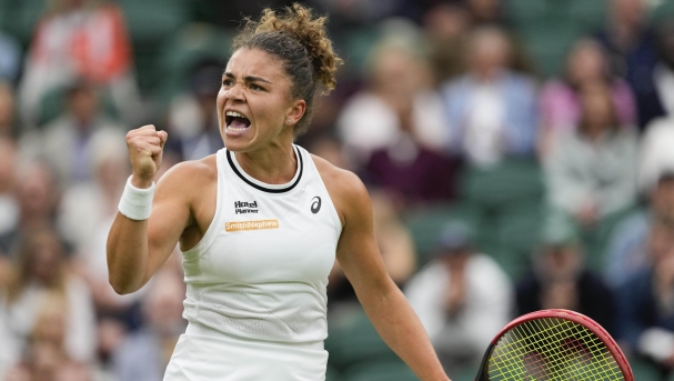 Jasmine Paolini of Italy reacts after winning a point against Emma Navarro of the United States during their quarterfinal match at the Wimbledon tennis championships in London, Tuesday, July 9, 2024. (AP Photo/Alberto Pezzali)
