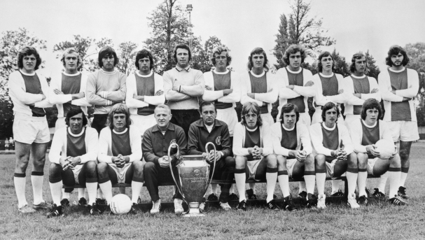 European Cup holders Ajax pose for a team photo with the trophy, 30th March 1973. Front row left to right, Sjaak Swart, Johnny Rep, coach Stephan Kovacs, trainer Bob Haarms, Ger Kleton, Jan Mulder, Johan Cruyff and Gerrie Muhren. Back row, left to right, Arie Haan, Horst Blankenburg, Sies Wever, Wim Suurbier, goalkeeper Heinz Stuy, Piet Keizer, Ruud Krol, Heinz Schilcher, Arnold Muhren, Johan Neeskens and Barry Hulshoff. (Photo by Central Press/Hulton Archive/Getty Images)