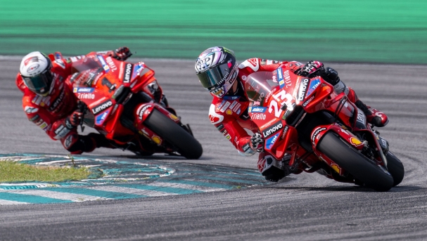 Ducati Italian rider Francesco Bagnaia (L) and Ducati Lenovo Team's Italian rider Enea Bastianini (R) take a corner during the second day of the pre-season MotoGP test at the Sepang International Circuit in Sepang on February 7, 2024. (Photo by MOHD RASFAN / AFP)