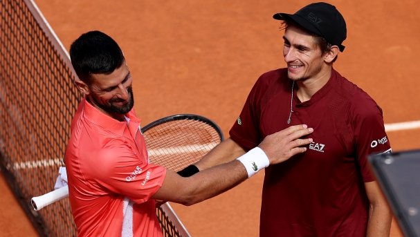 Matteo Arnaldi of Italy greets Novak Djokovic of Serbia at the net after his victory in the Men's Singles Second Round match during Day Five of the Mutua Madrid Open at La Caja Magica on April 26, 2025 in Madrid, Spain. (Photo by Clive Brunskill/Getty Images)