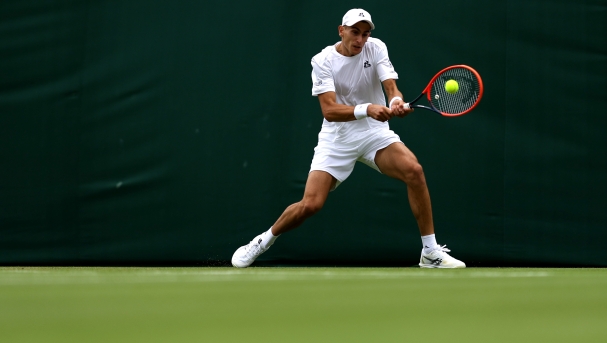Matteo Arnaldi of Italy plays a forehand against Frances Tiafoe of United States Gentlemen's Singles first round match during day one of The Championships Wimbledon 2024 at All England Lawn Tennis and Croquet Club on July 01, 2024 in London, England. (Photo by Julian Finney/Getty Images)