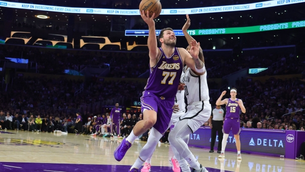  Luka Doncic #77 of the Los Angeles Lakers goes up for a layup while being defended by Ochai Agbaji # 30 of the Brooklyn Nets during the second half of an NBA game at Crypto.com Arena on March 27, 2026 in Los Angeles, California. NOTE TO USER: User expressly acknowledges and agrees that, by downloading and or using this photograph, User is consenting to the terms and conditions of the Getty Images License Agreement.   Kevin Terrell/Getty Images/AFP (Photo by Kevin Terrell / GETTY IMAGES NORTH AMERICA / Getty Images via AFP)
