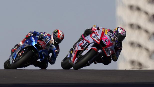 Enea Bastianini (23), of Italy, leads Alex Rins (42), of Spain, through a turn during an open practice session for the MotoGP Grand Prix of the Americas motorcycle race at the Circuit of the Americas, Saturday, April 9, 2022, in Austin, Texas. (AP Photo/Eric Gay)