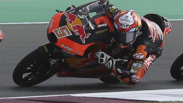 Turkish rider Deniz Oncu of the Red Bull KTM Tech 3, left and Spain's rider Jaume Masia of the Red Bull KTM Ajo in action during Moto GP 3at the Losail International Circuit in Doha, Qatar, Sunday, March 6, 2022. (AP Photo/Hussein Sayed)