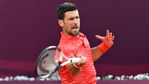 Serbia's Novak Djokovic plays a forehand return to France's Luca van Assche during their tennis singles match at the Sprska Tennis Open ATP 250 series tournament in Banja Luka, on April 19, 2023. (Photo by ELVIS BARUKCIC / AFP)