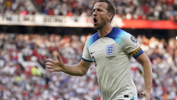 FILE - England's Harry Kane celebrates after scoring the opening goal during the Euro 2024 group C qualifying soccer match between England and North Macedonia at Old Trafford in Manchester, Monday June 19, 2023. On Saturday, July 15, 2023, Bayern Munich honorary president Uli Hoeneß is confident that Kane will switch to the club from Tottenham this summer. (AP Photo/Dave Thompson, File)