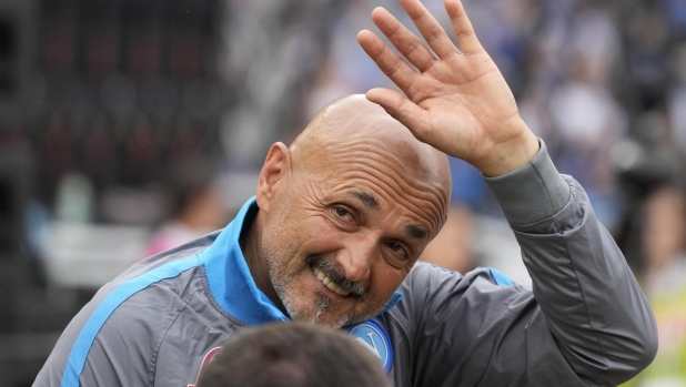 Napoli's head coach Luciano Spalletti wave to fans prior to the start of the Serie A soccer match between Napoli and Sampdoria at the Diego Maradona Stadium, in Naples, Sunday, June 4, 2023. (AP Photo/Andrew Medichini)