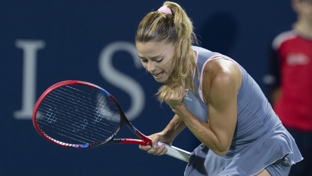 Camila Giorgi, of Italy, reacts after defeating Bianca Andreescu, of Canada, during the National Bank Open women's tennis tournament Tuesday, Aug. 8, 2023, in Montreal. (Christinne Muschi/The Canadian Press via AP)