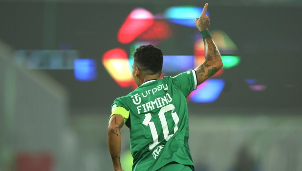 JEDDAH, SAUDI ARABIA - AUGUST 11: Roberto Firmino of Al-Ahli celebrates after scoring the team's second goal during the Saudi Pro League match between Al-Ahli Saudi and Al-Hazm at the Prince Abdullah AlFaisal stadium on August 11, 2023 in Jeddah, Saudi Arabia. (Photo by Yasser Bakhsh/Getty Images)