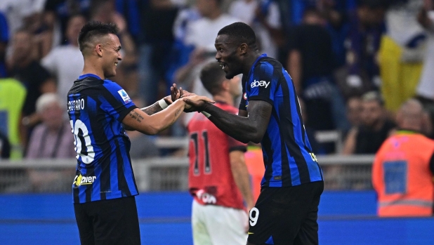 MILAN, ITALY - SEPTEMBER 16: Marcus Thuram of FC Internazionale celebrates with Lautaro Martinez after scoring their team's second goal during the Serie A TIM match between FC Internazionale and AC Milan at Stadio Giuseppe Meazza on September 16, 2023 in Milan, Italy. (Photo by Mattia Ozbot - Inter/Inter via Getty Images)