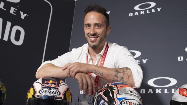 SCARPERIA, ITALY - JUNE 08: Andrea Dovizioso of Italy poses near the helmets during the MotoGP? Legends Hall of Fame - Press Conference during the MotoGP of Italy - Previews at Mugello Circuit on June 08, 2023 in Scarperia, Italy. (Photo by Mirco Lazzari gp/Getty Images)
