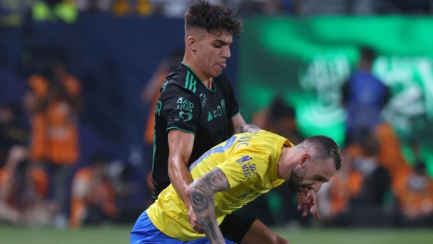 Ahli's Spanish midfielder #24 Gabri Veiga (L) marks Nassr's Croatian midfielder #77 Marcelo Brozovic during the Saudi Pro League football match between Al-Nassr and Al-Ahli at the King Saud University Stadium in Riyadh, on September 22, 2023. (Photo by Fayez Nureldine / AFP)