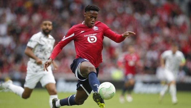 Lille's Jonathan David controls the ball during the UEFA Conference League between Lille and NK Olimpija Ljubljana, Wednesday, Sept 20, 2023, at the Pierre Mauroy stadium in Villeneuve-d'Ascq, outside Lille northern France. (AP Photo/Michel Spingler)