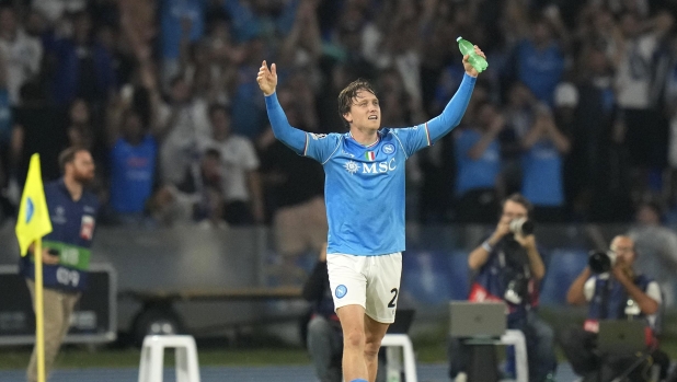 Napoli's Piotr Zielinski celebrates after scoring his sides second goal during the Champions League group C soccer match between Napoli and Real Madrid at the Diego Armando Maradona stadium in Naples, Italy, Tuesday, Oct. 3, 2023. (AP Photo/Alessandra Tarantino)
