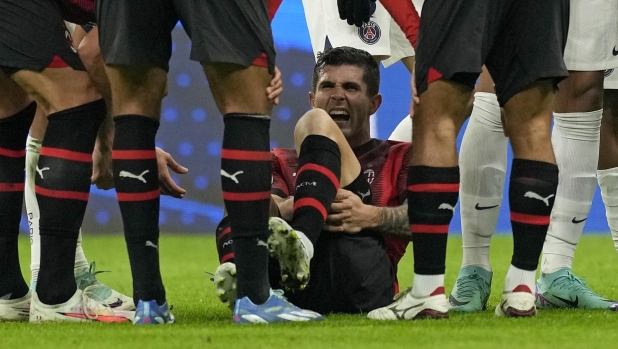 AC Milan's Christian Pulisic reacts after getting injured during the Champions League group F soccer match between AC Milan and Paris Saint Germain at the San Siro stadium in Milan, Italy, Tuesday, Nov. 7, 2023. (AP Photo/Antonio Calanni)
