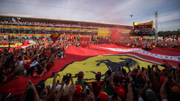 MONZA, ITALY - SEPTEMBER 03: A general view as the Tifosi celebrate during the podium celebrations with Race winner Max Verstappen of the Netherlands and Oracle Red Bull Racing, Second placed Sergio Perez of Mexico and Oracle Red Bull Racing and Third placed Carlos Sainz of Spain and Ferrari during the F1 Grand Prix of Italy at Autodromo Nazionale Monza on September 03, 2023 in Monza, Italy. (Photo by Ryan Pierse/Getty Images)