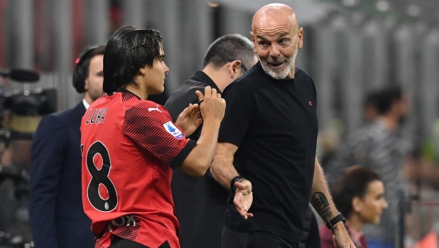 MILAN, ITALY - OCTOBER 22:  Head coach of AC Milan Stefano Pioli reacts with Luka Romero during the Serie A TIM match between AC Milan and Juventus at Stadio Giuseppe Meazza on October 22, 2023 in Milan, Italy. (Photo by Claudio Villa/AC Milan via Getty Images)