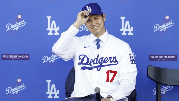 epa11030232 Newly-signed Los Angeles Dodgers baseball player Shohei Ohtani, of Japan, during an introductory press conference in Los Angeles, California, USA, 14 December 2023. Ohtani recently signed a 10-year deal with the team for $700/â?¬636 million, making him the highest paid player in baseball history.  EPA/CAROLINE BREHMAN