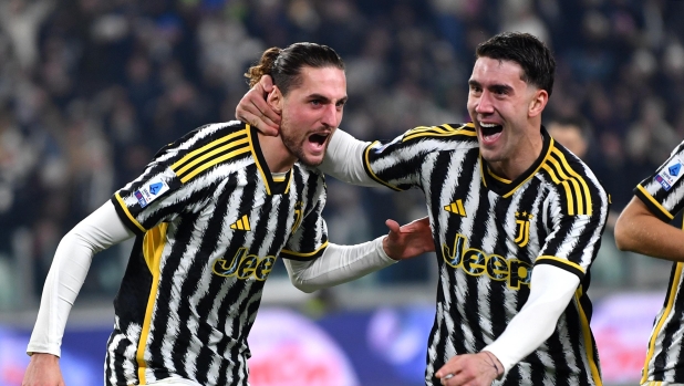 TURIN, ITALY - DECEMBER 30: Adrien Rabiot of Juventus celebrates with team mate Dusan Vlahovic after scoring their sides first goal during the Serie A TIM match between Juventus and AS Roma at  on December 30, 2023 in Turin, Italy. (Photo by Valerio Pennicino/Getty Images)
