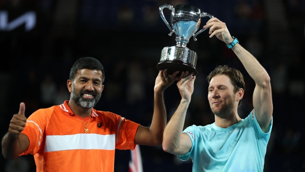MELBOURNE, AUSTRALIA - JANUARY 27: Rohan Bopanna of India and Matthew Ebden of Australia pose with the championship trophy after their Men?s Doubles Final match against Simone Bolelli and Andrea Vavassori of Italy during the 2024 Australian Open at Melbourne Park on January 27, 2024 in Melbourne, Australia. (Photo by Daniel Pockett/Getty Images)