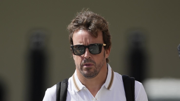 Aston Martin's Spanish driver Fernando Alonso arrives at the Yas Marina racetrack in Abu Dhabi, United Arab Emirates, Thursday, Nov. 23, 2023. (AP Photo/Kamran Jebreili)