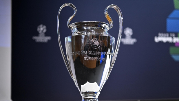 This photograph taken on December 18, 2023, shows the UEFA Champions League trophy ahead of the 2023-2024 UEFA Champions League football tournament round of 16 draw at the House of European Football in Nyon. (Photo by Fabrice COFFRINI / AFP)