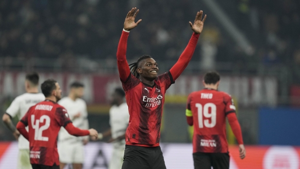 AC Milan's Rafael Leao celebrates after scoring his side's third goal during the Europa League play-off first leg soccer match between AC Milan and Rennes at the San Siro Stadium, in Milan, Italy, Thursday, Feb. 15, 2024. (AP Photo/Antonio Calanni)