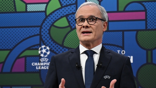 UEFA Deputy General Secretary, Giorgio Marchetti delivers a speech during the 2023-2024 UEFA Champions League football tournament round of 16 draw at the House of European Football in Nyon, on December 18, 2023. (Photo by Fabrice COFFRINI / AFP)