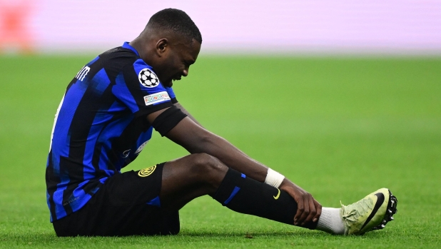 Inter Milan's French forward #09 Marcus Thuram reacts during the UEFA Champions League last 16 first leg football match Inter Milan vs Atletico Madrid at the San Siro stadium in Milan on February 20, 2024. (Photo by Marco BERTORELLO / AFP)