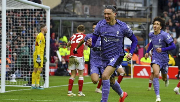 Liverpool's Darwin Nunez celebrates after scoring his side's opening goal during the English Premier League soccer match between Nottingham Forest and Liverpool at City ground in Nottingham, England, Saturday, March 2, 2024. (AP Photo/Rui Vieira)