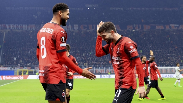 MILAN, ITALY - FEBRUARY 15: Ruben Loftus-Cheek of AC Milan celebrates with Christian Pulisic after scoring the his team's firs goal during the UEFA Europa League 2023/24 Knockout Round Play-offs First Leg match between AC Milan and Stade Rennais FC at Stadio Giuseppe Meazza on February 15, 2024 in Milan, Italy. (Photo by Giuseppe Cottini/AC Milan via Getty Images)