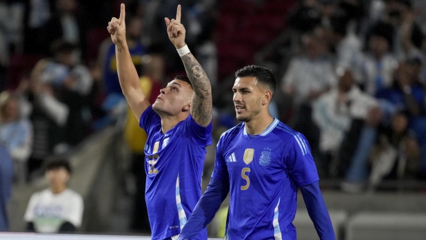 Argentina forward Lautaro Martinez, left, and midfielder Leandro Paredes (5) celebrate a goal against Costa Rica during the second half of an international friendly soccer match Tuesday, March 26, 2024, in Los Angeles. (AP Photo/Eric Thayer)