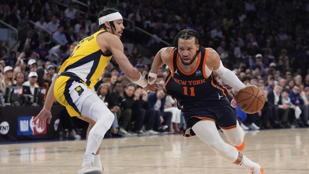 New York Knicks' Jalen Brunson (11) drives past Indiana Pacers' Andrew Nembhard (2) during the second half of Game 2 in an NBA basketball second-round playoff series, Wednesday, May 8, 2024, in New York. The Knicks won 130-121. (AP Photo/Frank Franklin II)