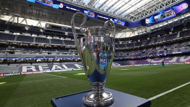 The championship's trophy is displayed on the pitch ahead of the UEFA Champions League semi final second leg football match between Real Madrid CF and FC Bayern Munich at the Santiago Bernabeu stadium in Madrid on May 8, 2024. (Photo by Thomas COEX / AFP)