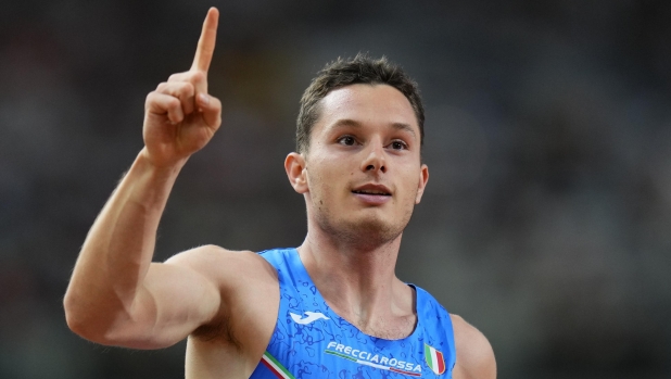 Filippo Tortu, of Italy reacts after anchorong his team to win a Men's 4x100-meters relay heat during the World Athletics Championships in Budapest, Hungary, Friday, Aug. 25, 2023. (AP Photo/Petr David Josek)