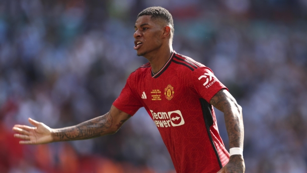 Manchester United's Marcus Rashford celebrates after his team won the English FA Cup final soccer match between Manchester City and Manchester United at Wembley Stadium in London, Saturday, May 25, 2024. (AP Photo/Ian Walton)