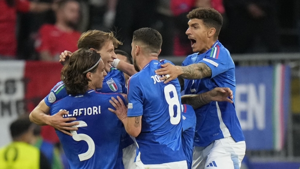 Italy's Nicolo Barella, second left, celebrates with his teammates after scoring his side's second goal during a Group B match between Italy and Albania at the Euro 2024 soccer tournament in Dortmund, Germany, Saturday, June 15, 2024. (AP Photo/Alessandra Tarantino)