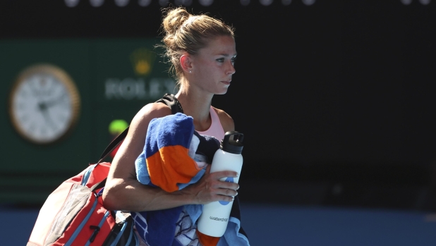 Camila Giorgi of Italy walks from the court following her first round loss to Victoria Azarenka of Belarus at the Australian Open tennis championships at Melbourne Park, Melbourne, Australia, Tuesday, Jan. 16, 2024. (AP Photo/Asanka Brendon Ratnayake)