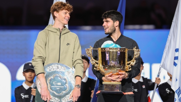 BEIJING, CHINA - OCTOBER 02: Carlos Alcaraz of Spain and Jannik Sinner of Italy poses with the winners trophy after the Men's Singles Finals match on Day 10 of the China Open at National Tennis Center on October 02, 2024 in Beijing, China. (Photo by Lintao Zhang/Getty Images)