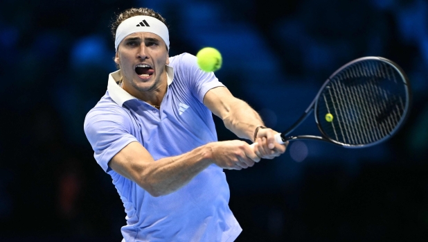 Germany's Alexander Zverev hits a return to Russia's Andrey Rublev during their match at the ATP Finals tennis tournament in Turin on November 11, 2024. (Photo by Marco BERTORELLO / AFP)