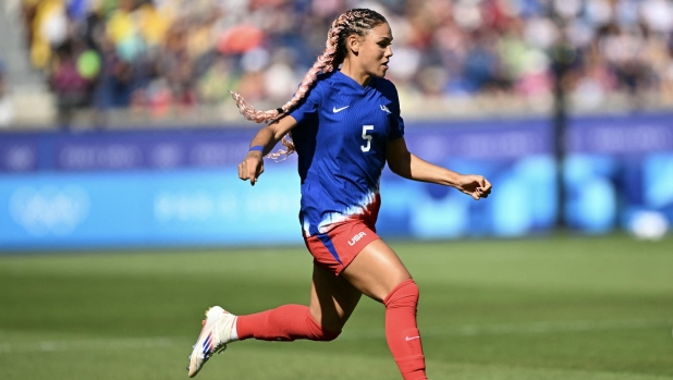 US' forward #05 Trinity Rodman controls the ball in the women's gold medal final football match between Brazil and US during the Paris 2024 Olympic Games at the Parc des Princes in Paris on August 10, 2024. (Photo by Patricia DE MELO MOREIRA / AFP)