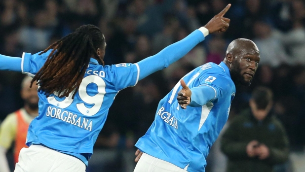 Napoli's Belgian forward #11 Romelu Lukaku (R) celebrates scoring his team's second goal with teammate Napoli's Cameroon midfielder #99 Andre Zambo Anguissa during the Italian Serie A football match between Napoli and Juventus at the Diego Armando Maradona stadium in Naples on January 25, 2025. (Photo by Carlo Hermann / AFP)